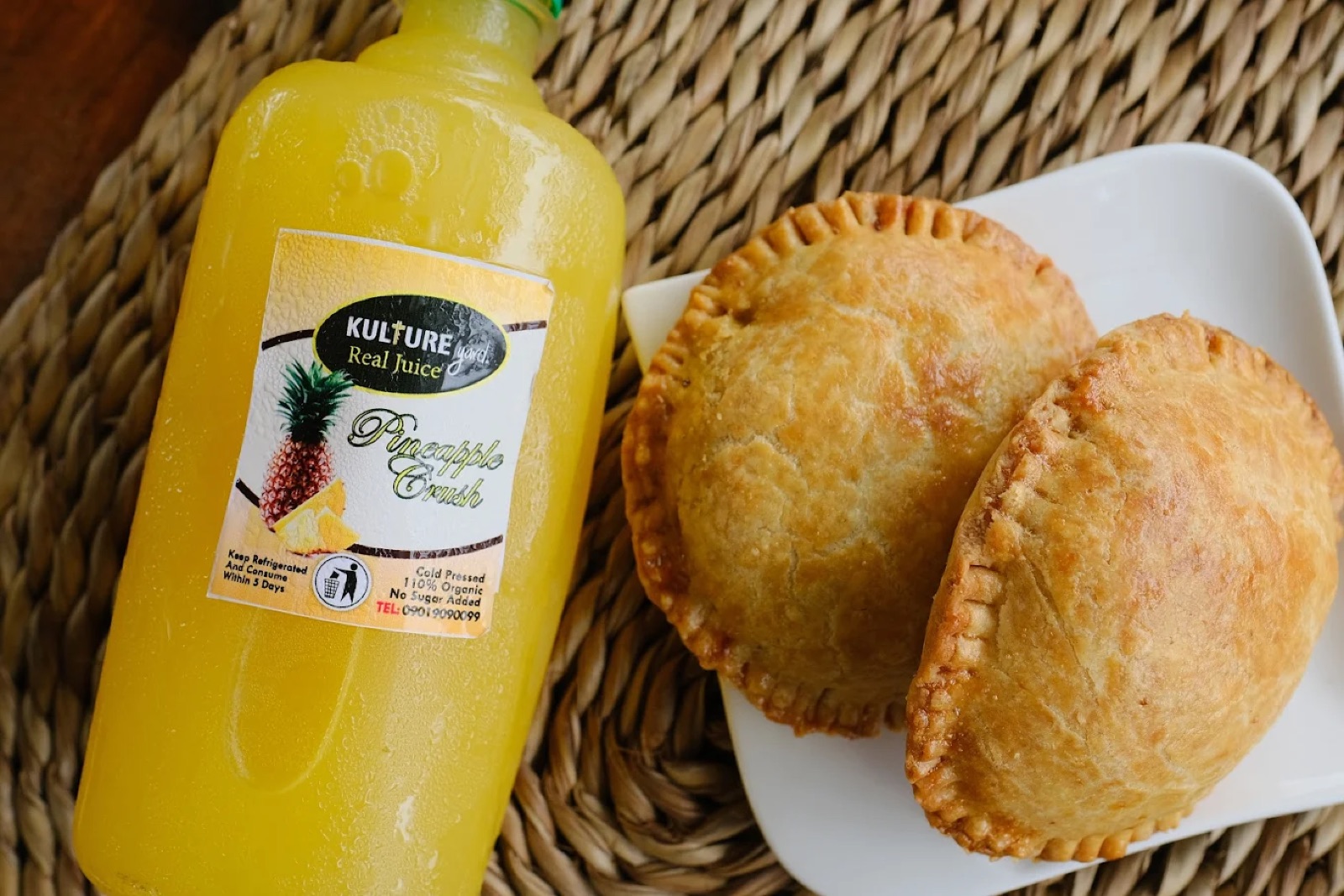 Kulture Yard cold-pressed Pineapple Crush juice with house-made meat pies