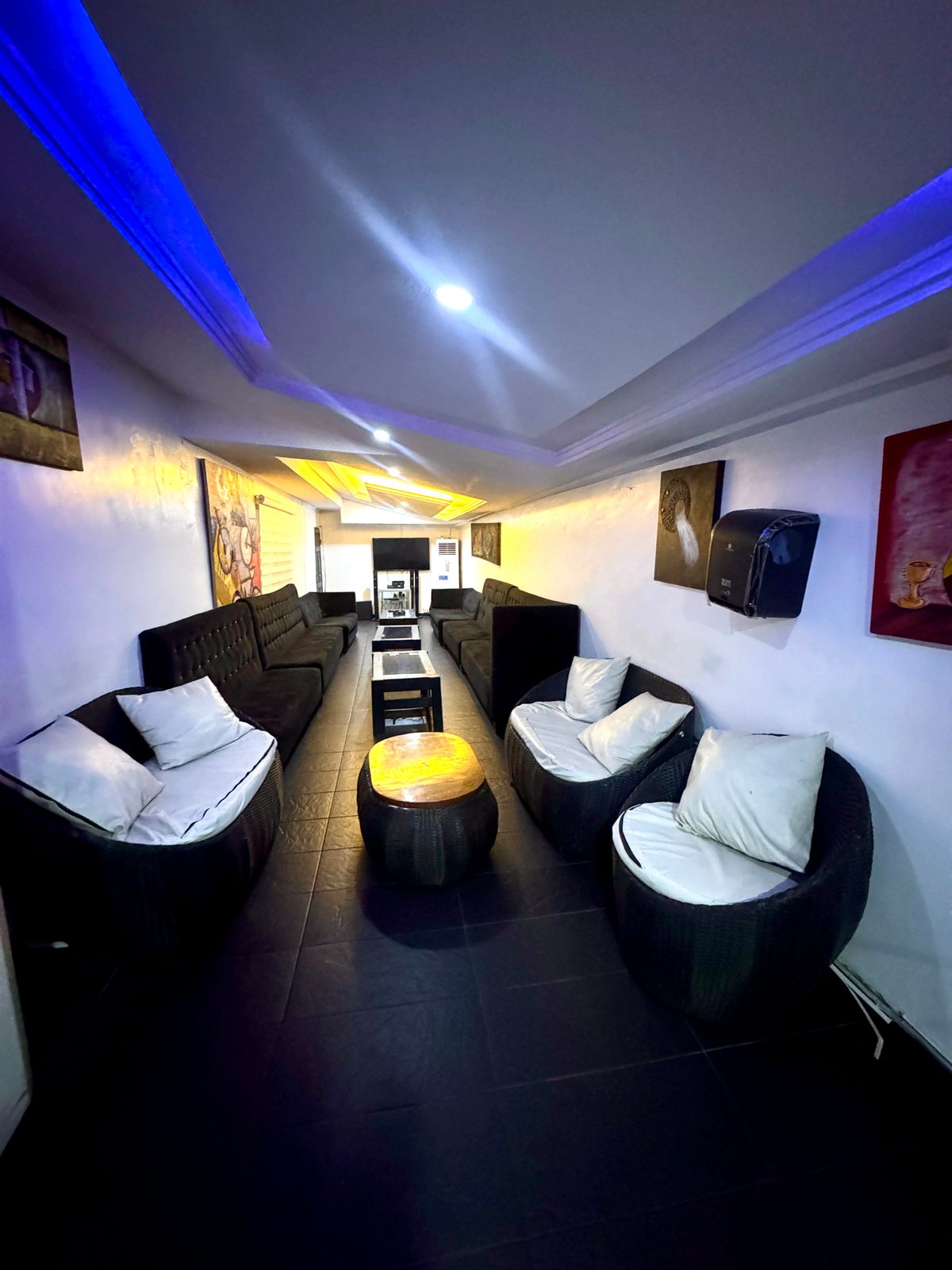 VIP lounge interior with plush sofas and ambient lighting